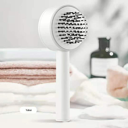 Selbstreingende Haarbürste mit Massageeffekt